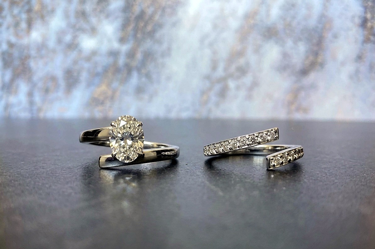 Oval solitaire and open pavé band ring set